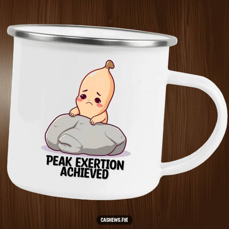 Funny cashew camping mug with a cashew grimacing while lifting a pebble, ideal for outdoor enthusiasts.