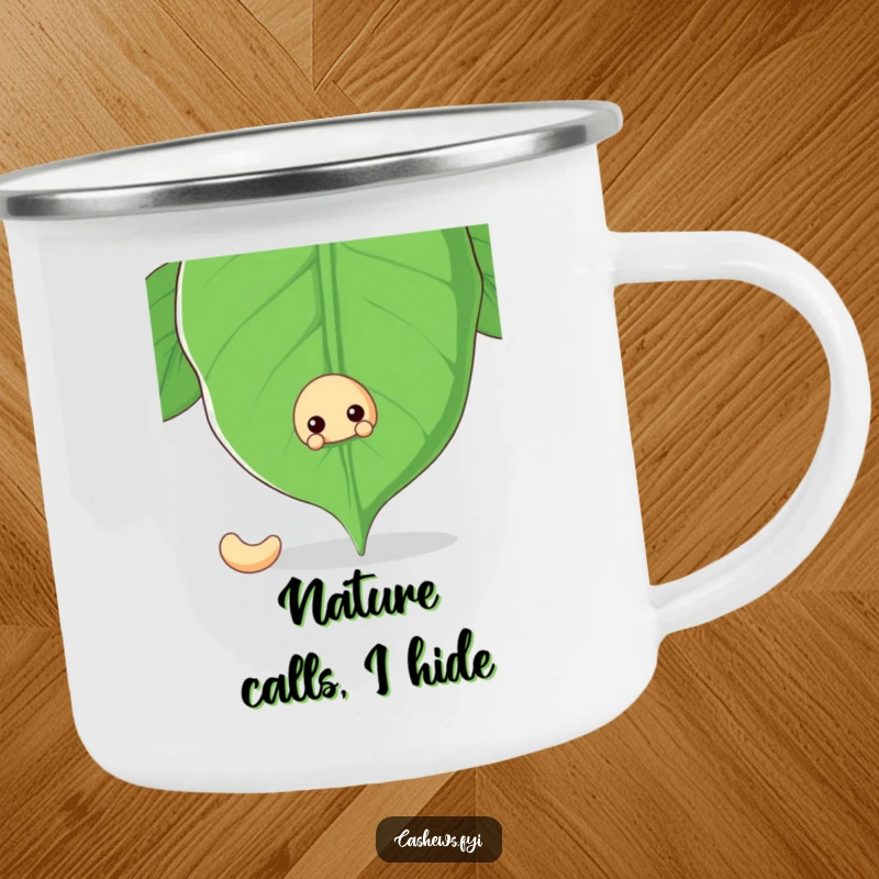 Funny camping mug with a cashew nut peeking from behind a large cashew leaf, ideal for campers who enjoy nature and humor.