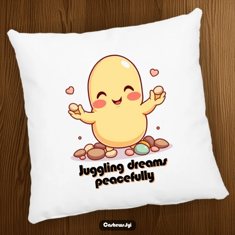 Funny pillow featuring a smiling cashew nut character juggling tiny pebbles, promoting focus.