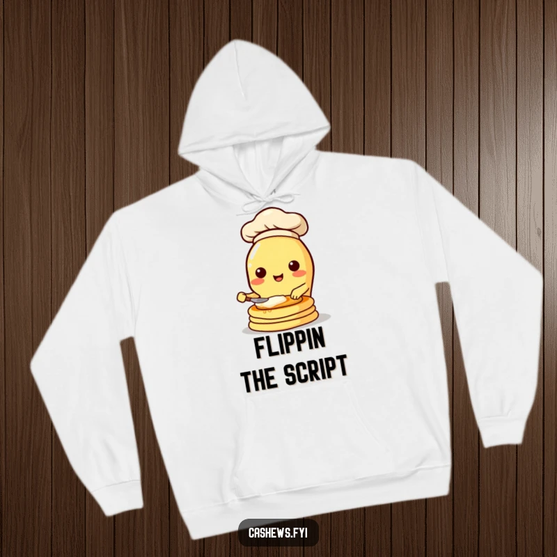 Funny hooded sweatshirt showcasing a cute kawaii cashew chef flipping pancakes with great enthusiasm, perfect for cozy laughs.
