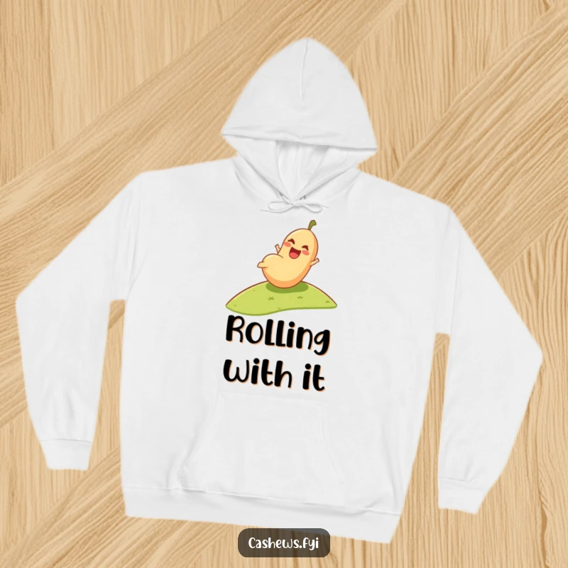 Funny Hoodie: A happy cashew tumbles downhill with pure glee, captured on a cozy sweatshirt for ultimate comfort and humor.