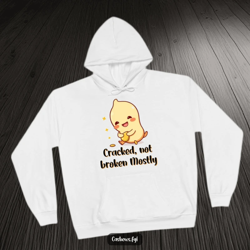 Funny hoodie showcasing a cashew character tripping, holding a broken cashew, and laughing, designed for maximum warmth and humor.