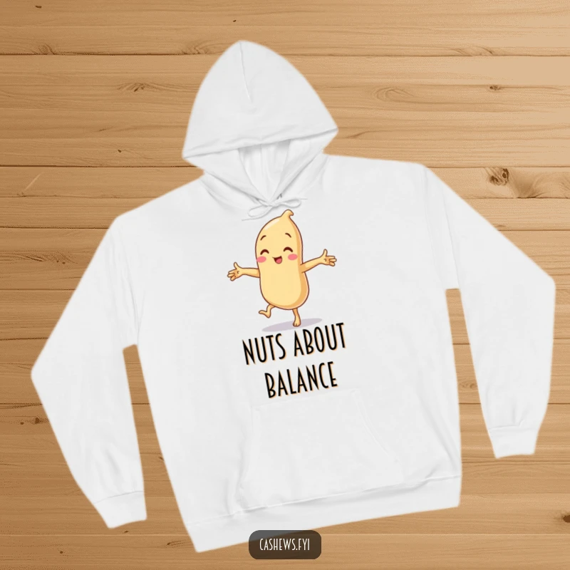 Funny hoodie showcasing a cashew in a comical one-legged balancing act, arms spread wide in a silly, funny pose.