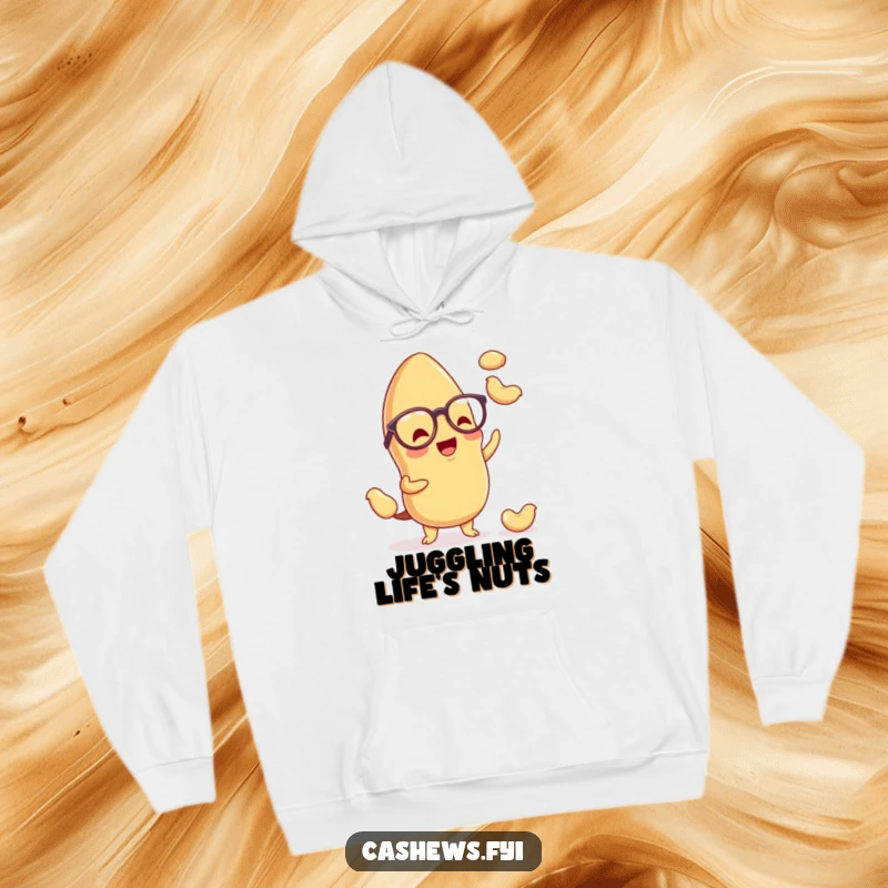 Funny kawaii cashew hoodie featuring a charming nut with spectacles, enthusiastically juggling miniature cashews, offering warmth and humor.